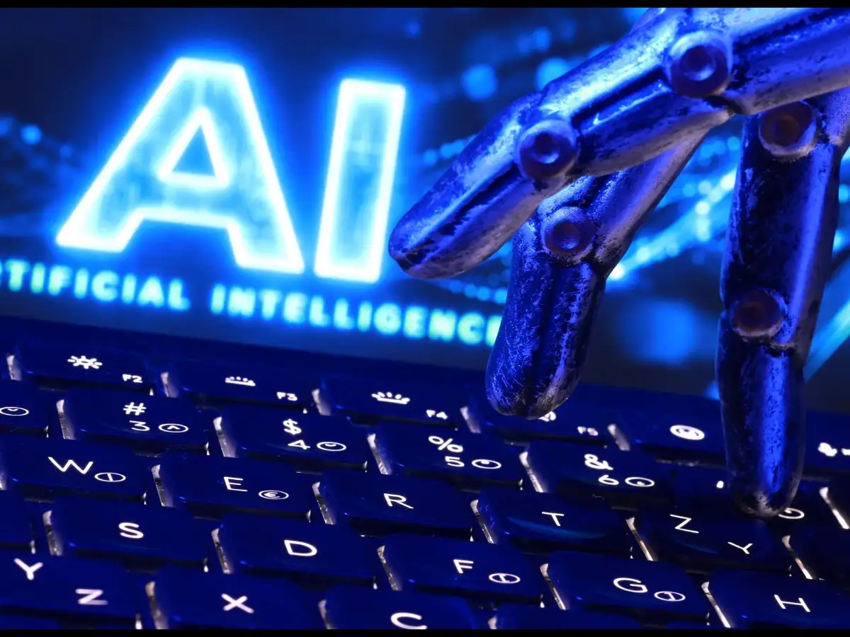 "AI Artificial Intelligence" words, a keyboard and a robotics hand in this illustration taken, September 23, 2026. "AI Artificial Intelligence" words, a keyboard and a robotics hand in this illustration taken, September 23, 2026.